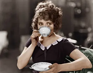 Teacup: Portrait of woman drinking from teacup