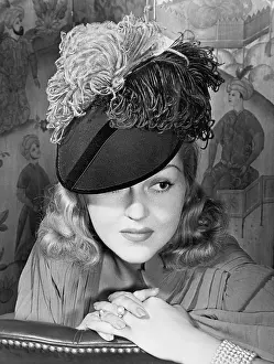 Close Ups: Portrait of a woman with a feathered hat