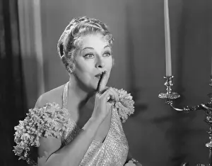 Earnest: Portrait of woman gesturing for quiet