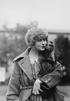 Maternal: Portrait of woman with monkey