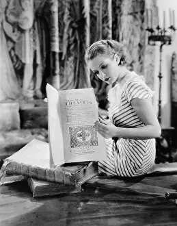 Intent: Portrait of woman reading Catholic text