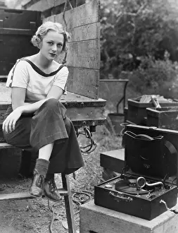 Portability: Portrait of woman with record player