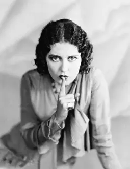Emphasis: Portrait of woman shushing