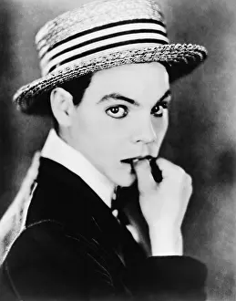 Intensity: Portrait of woman in suit and hat