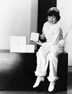 Cubes: Portrait of a young girl playing with blocks