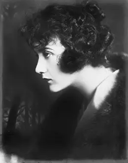Lamenting: Portrait of a young woman looking serious