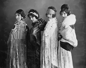 Coordinate: Portrait of four young women posing in shawls