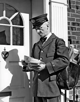 Mailman: Postal Service Uniformed Mailman Delivering Mail Standing On