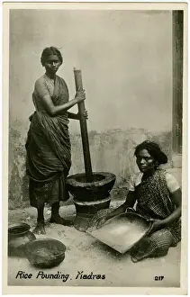 Pounding: Pounding Rice using large pestle and mortar - Chennai, India