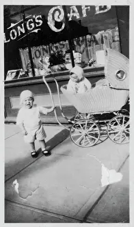 Anxiously: PRAM OUTSIDE CAFE/1932