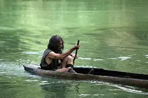 Temps: Prehistoric man in a canoe