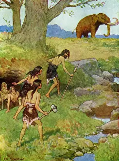 Mammoths: Prehistoric men hunting a mammoth in Britain