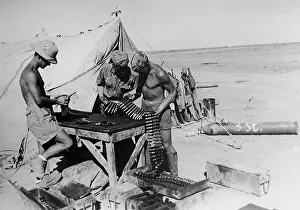 Strap: Preparing munitions for fighter planes, 1942
