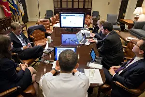 Advisors: President Barack Obama (center, back to camera)