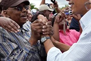 Mich: President Barack Obama greets a man in the ?