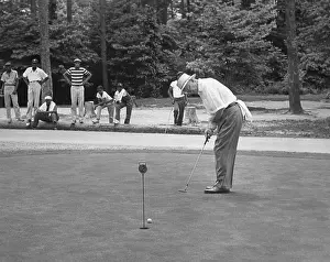Caddies: President Dwight Eisenhower on a putting green