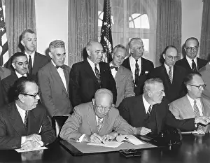 Reactors: President Eisenhower initialing the first agreement