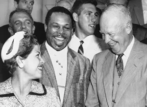 Notables: President Eisenhower laughs with champion golfer