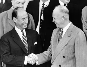 Loosing: President Eisenhower shakes hands with his ?
