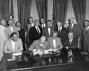 Atoms: President Eisenhower signs the Atomic Energy Act
