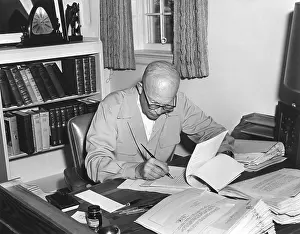Law Making: President Eisenhower signs various bills at his