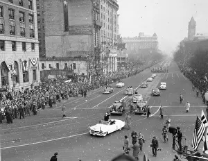Inaugurations: President Eisenhower standing in an open car in
