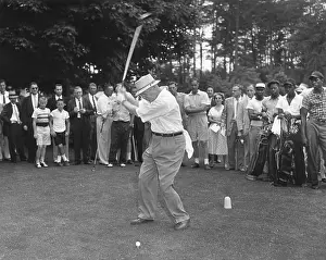 Teeing: President Eisenhower teeing off on a golf course