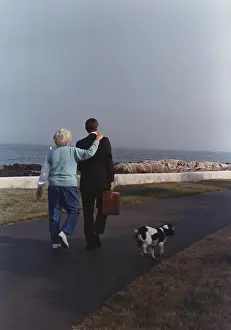 Trots: President George and Barbara Bush walk as ?