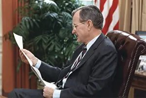 Centrist: President George H.W. Bush, reading a document