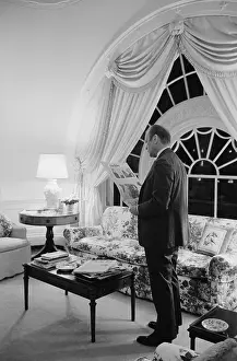 Lcgr1511: President Gerald Ford reading the newspaper in the