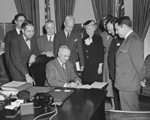 Howland: President Harry Truman with members of Conference