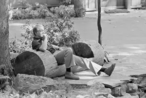 Hewn: President Jimmy Carter sitting in a rustic ?