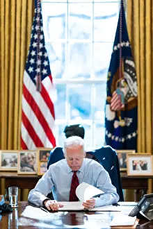 Potus: President Joe Biden reading documents at his desk