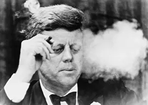 Fundraiser: President John Kennedy, smoking a small ?