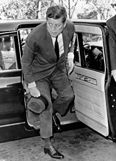 Dismantle: President John Kennedy steps from his limousine ?