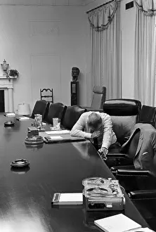 Postures: President Johnson appears agonized as he ?