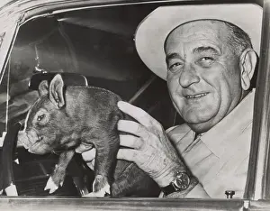 Earthy: President Lyndon Johnson holds a squirming