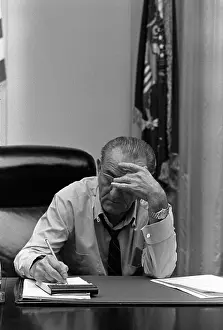 Bsloc 201: President Lyndon Johnson making notes in ?