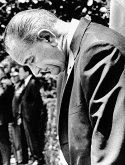 Banda: President Lyndon Johnson stands with head ?