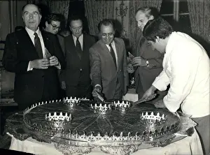 Requires: President Mitterand with giant traditional king cake