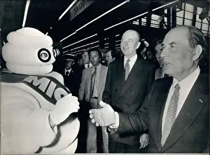 Mitterrand: President Mitterrand with Michelin Man at a car show