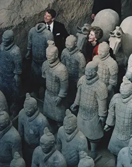 Xi An: President and Nancy Reagan standing with ?