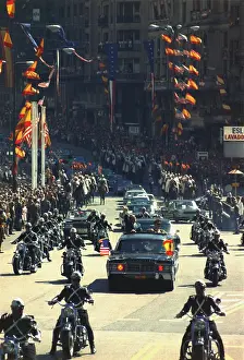 Limousines: President Nixon waves to the crowd during ?