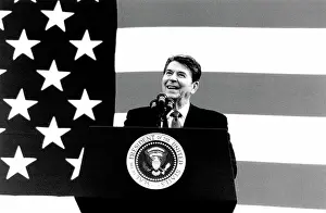 Rgnlbd: President Ronald Reagan at a podium with ?