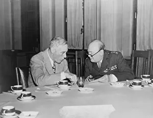Huddles: President Roosevelt huddles with his ally, ?