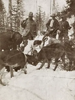 4 People: President Theodore Roosevelt standing over a big