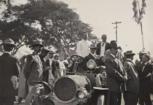 15 20 People: President Theodore Roosevelt standing in a car at