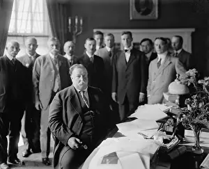 Centered: President William H. Taft at his desk in ?