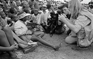 Oosterbroek: Press photographers crowd around a child, holding