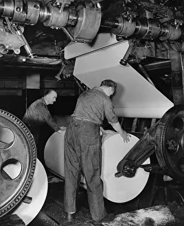 Pressmen: Pressman Loading Roll of Paper on Newspaper Press